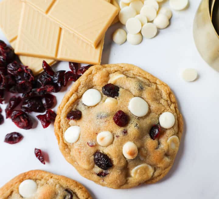 Soft Cranberry White Chocolate Chip Cookies are perfectly chewy with buttery crispy edges filled with sweet dried cranberries and creamy white chocolate chip chips. The Best White Chocolate Chip Cookie Recipe!