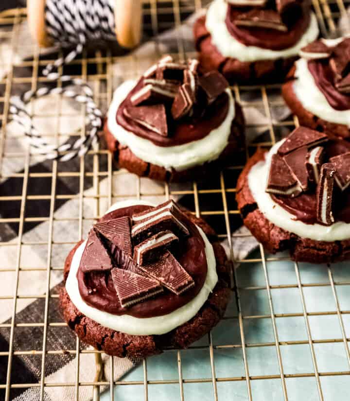 Frosted Mint Chocolate Brownie Cookies are made with a chewy double chocolate cookie, topped with creamy mint frosting, chocolate ganache, and Andes mints. These Andes Mint Cookies are the perfect holiday mint chocolate cookie recipe!