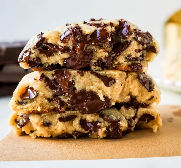 Levain Bakery Two Chip Chocolate Chip Cookie Recipe is their classic chocolate chip cookie made without nuts. Perfectly crispy on the outside and satisfyingly thick and gooey in the center, this cookie is brimming with semi-sweet and dark chocolate chips.