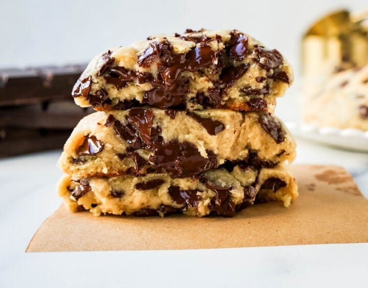 Levain Bakery Two Chip Chocolate Chip Cookie Recipe is their classic chocolate chip cookie made without nuts. Perfectly crispy on the outside and satisfyingly thick and gooey in the center, this cookie is brimming with semi-sweet and dark chocolate chips.