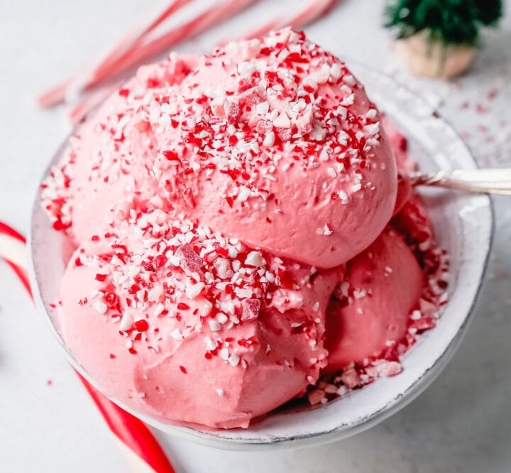 Creamy Homemade Peppermint Ice Cream made with heavy cream, milk, sugar, peppermint extract, and crushed candy canes (or peppermint bark for homemade peppermint bark ice cream). This is the best peppermint ice cream recipe!