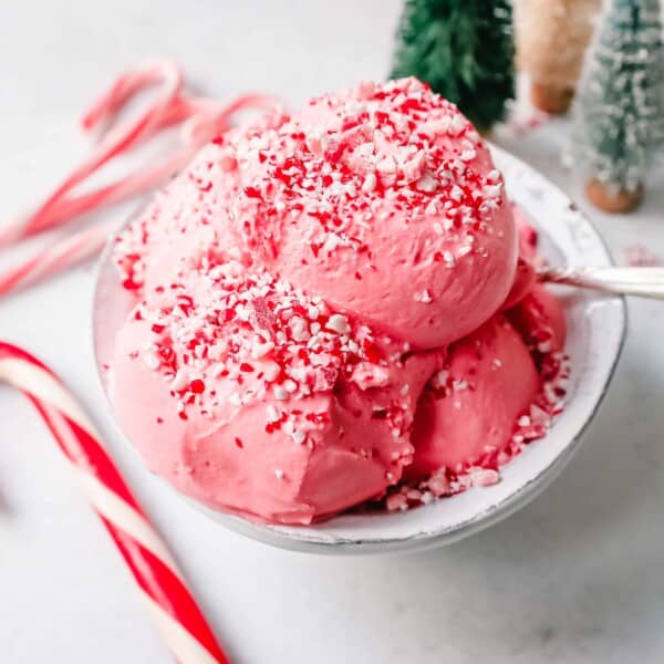 Creamy Homemade Peppermint Ice Cream made with heavy cream, milk, sugar, peppermint extract, and crushed candy canes (or peppermint bark for homemade peppermint bark ice cream). This is the best peppermint ice cream recipe!