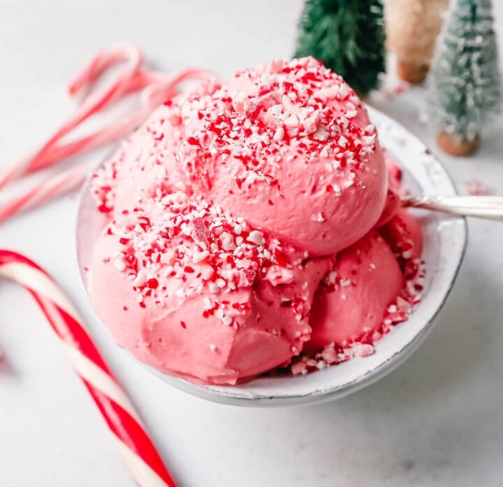 Creamy Homemade Peppermint Ice Cream made with heavy cream, milk, sugar, peppermint extract, and crushed candy canes (or peppermint bark for homemade peppermint bark ice cream). This is the best peppermint ice cream recipe!