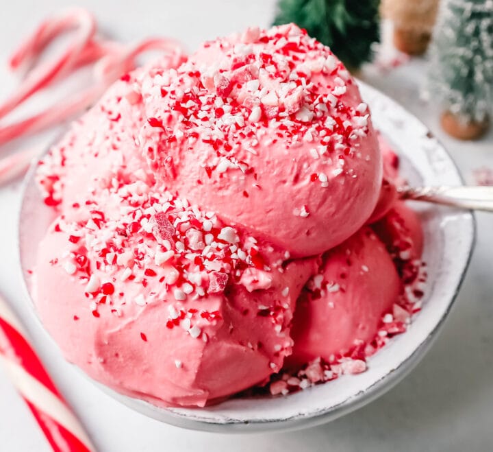 Creamy Homemade Peppermint Ice Cream made with heavy cream, milk, sugar, peppermint extract, and crushed candy canes (or peppermint bark for homemade peppermint bark ice cream). This is the best peppermint ice cream recipe!