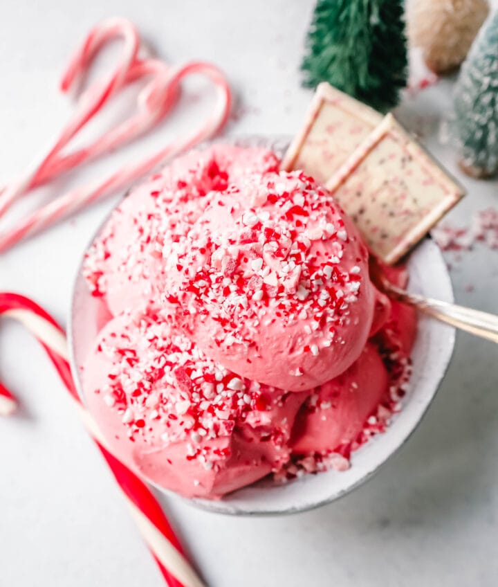 Creamy Homemade Peppermint Ice Cream made with heavy cream, milk, sugar, peppermint extract, and crushed candy canes (or peppermint bark for homemade peppermint bark ice cream). This is the best peppermint ice cream recipe!