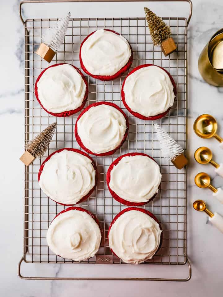 Soft, chewy homemade red velvet cookies topped with a sweet cream cheese frosting. A festive and delicious Christmas cookie recipe!