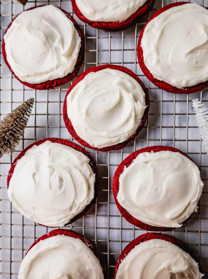 Soft, chewy homemade red velvet cookies topped with a sweet cream cheese frosting. A festive and delicious Christmas cookie recipe!