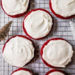 Soft, chewy homemade red velvet cookies topped with a sweet cream cheese frosting. A festive and delicious Christmas cookie recipe!