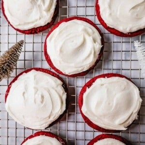 Soft, chewy homemade red velvet cookies topped with a sweet cream cheese frosting. A festive and delicious Christmas cookie recipe!