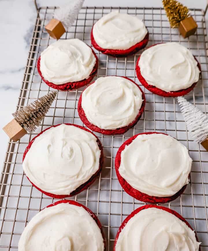 Soft, chewy homemade red velvet cookies topped with a sweet cream cheese frosting. A festive and delicious Christmas cookie recipe!