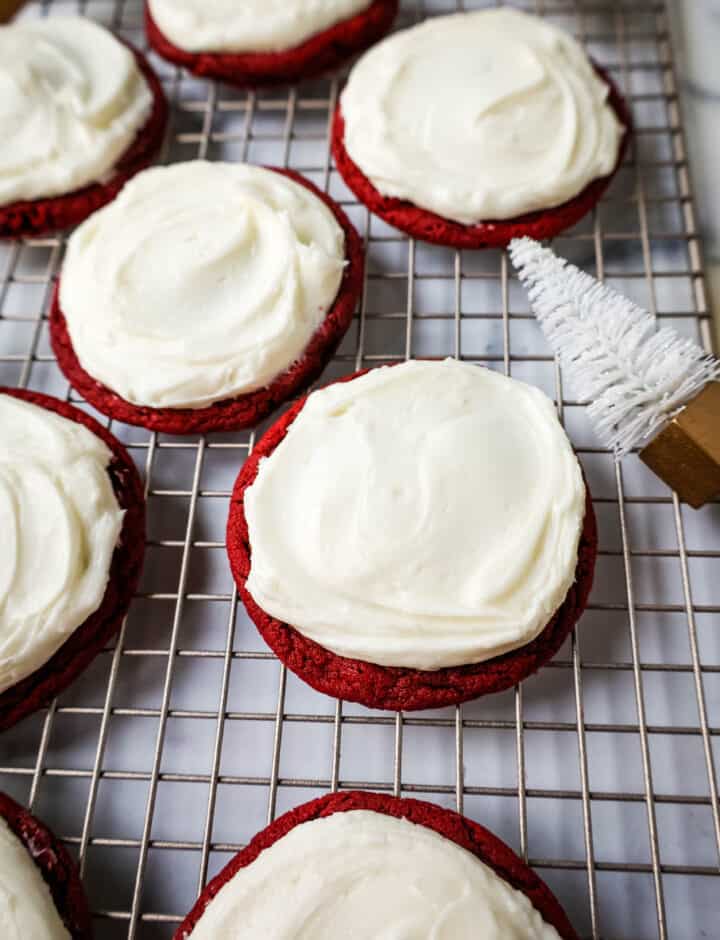 Soft, chewy homemade red velvet cookies topped with a sweet cream cheese frosting. A festive and delicious Christmas cookie recipe!