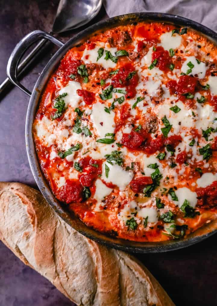 Quick, easy Skillet Lasagna made in 35 minutes is filled with bolognese meat sauce, ricotta parmesan cheese filling, mozzarella cheese, and fresh herbs. This is the best skillet lasagna recipe!