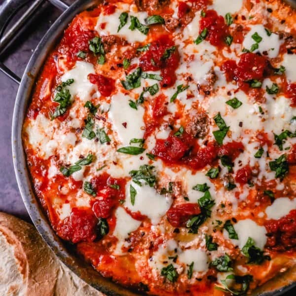 Quick, easy Skillet Lasagna made in 35 minutes is filled with bolognese meat sauce, ricotta parmesan cheese filling, mozzarella cheese, and fresh herbs. This is the best skillet lasagna recipe!