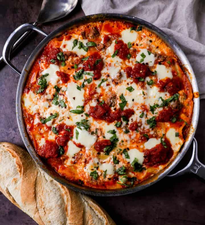 Quick, easy Skillet Lasagna made in 35 minutes is filled with bolognese meat sauce, ricotta parmesan cheese filling, mozzarella cheese, and fresh herbs. This is the best skillet lasagna recipe!