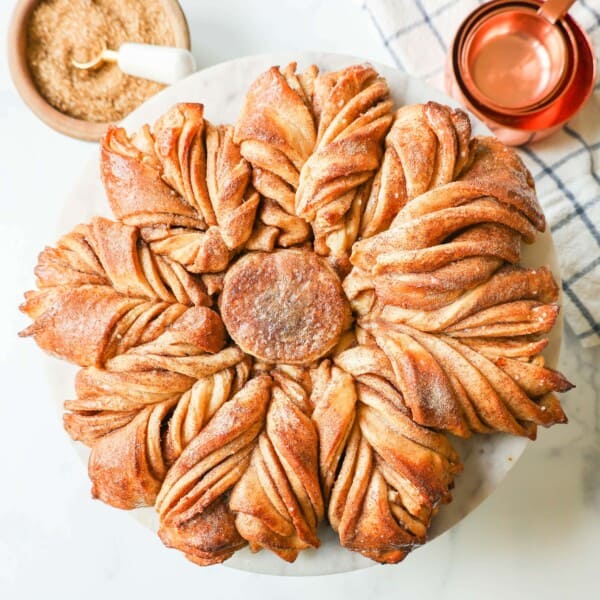 This Star Bread is a pull-apart bread that is perfectly soft and fluffy and filled with your favorite fillings. This is a Cinnamon Sugar Star Bread with layers of butter, cinnamon, and sugar, and shaped into a beautiful star.