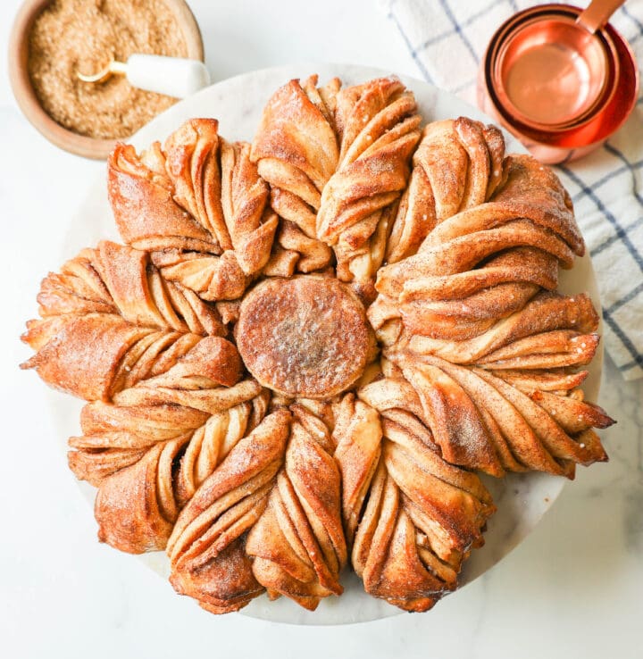 This Star Bread is a pull-apart bread that is perfectly soft and fluffy and filled with your favorite fillings. This is a Cinnamon Sugar Star Bread with layers of butter, cinnamon, and sugar, and shaped into a beautiful star.