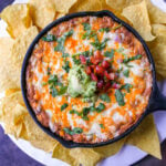 This is the best bean dip recipe ever! This is such an easy bean and cheese dip made with creamy beans, sour cream, cream cheese, taco seasoning, hot sauce, and lots of Mexican cheese! This easy bean dip is the best appetizer recipe. 