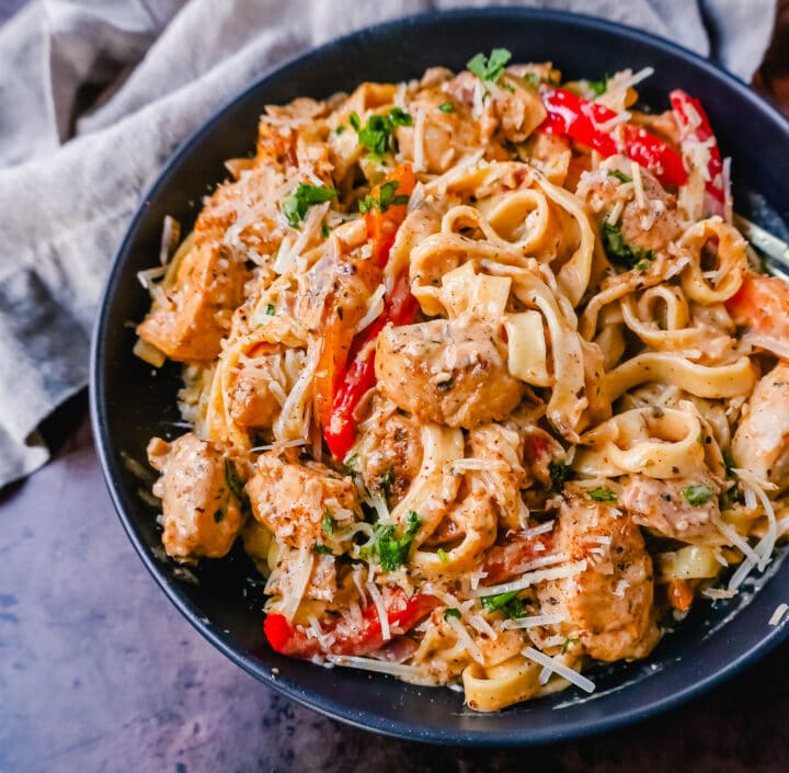 Creamy Cajun Chicken Pasta is the perfect cajun chicken alfredo dish made with tender chicken tossed in cajun seasoning in a rich, creamy alfredo sauce. The perfect spicy chicken pasta!