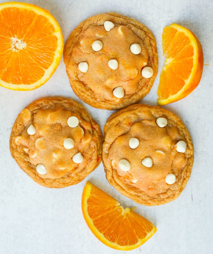 Soft and Chewy Orange Creamsicle Cookies made with fresh orange zest and juice and white chocolate chips. This Orange White Chocolate Cookie recipe is the perfect orange cookie.