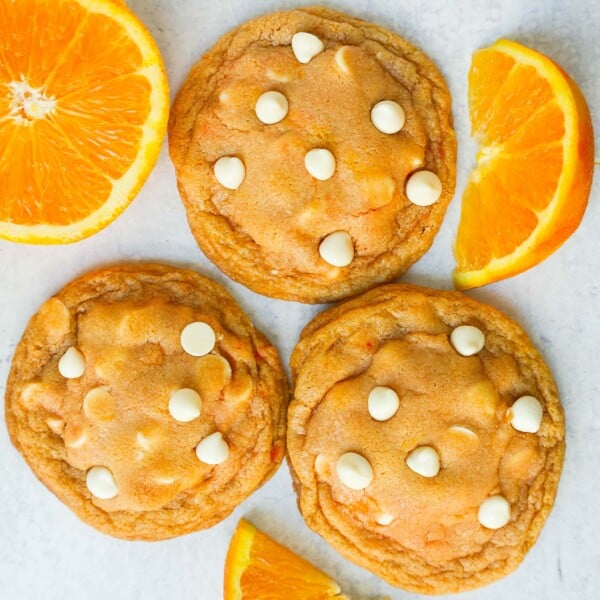 Soft and Chewy Orange Creamsicle Cookies made with fresh orange zest and juice and white chocolate chips. This Orange White Chocolate Cookie recipe is the perfect orange cookie.