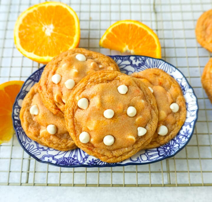 Soft and Chewy Orange Creamsicle Cookies made with fresh orange zest and juice and white chocolate chips. This Orange White Chocolate Cookie recipe is the perfect orange cookie.