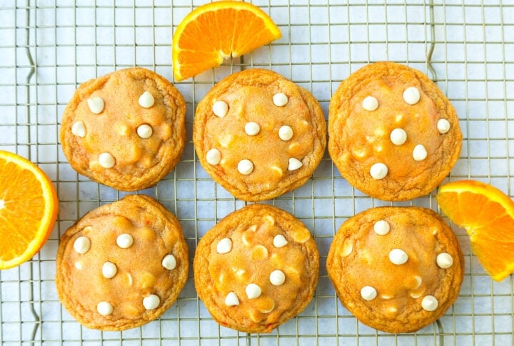 Soft and Chewy Orange Creamsicle Cookies made with fresh orange zest and juice and white chocolate chips. This Orange White Chocolate Cookie recipe is the perfect orange cookie.