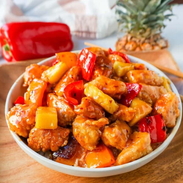 Sweet and Sour Chicken is made with crispy fried chicken covered in a pineapple sweet and sour sauce. The ultimate Sweet and Sour Chicken Recipe is way better than take-out.  