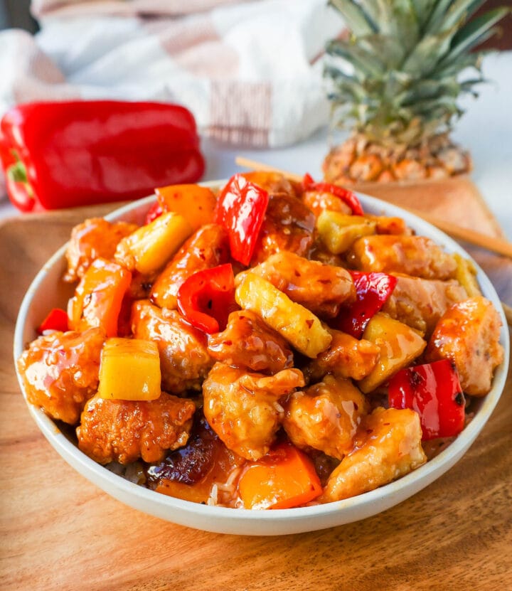 Sweet and Sour Chicken is made with crispy fried chicken covered in a pineapple sweet and sour sauce. The ultimate Sweet and Sour Chicken Recipe is way better than take-out.  