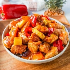 Sweet and Sour Chicken is made with crispy fried chicken covered in a pineapple sweet and sour sauce. The ultimate Sweet and Sour Chicken Recipe is way better than take-out.  