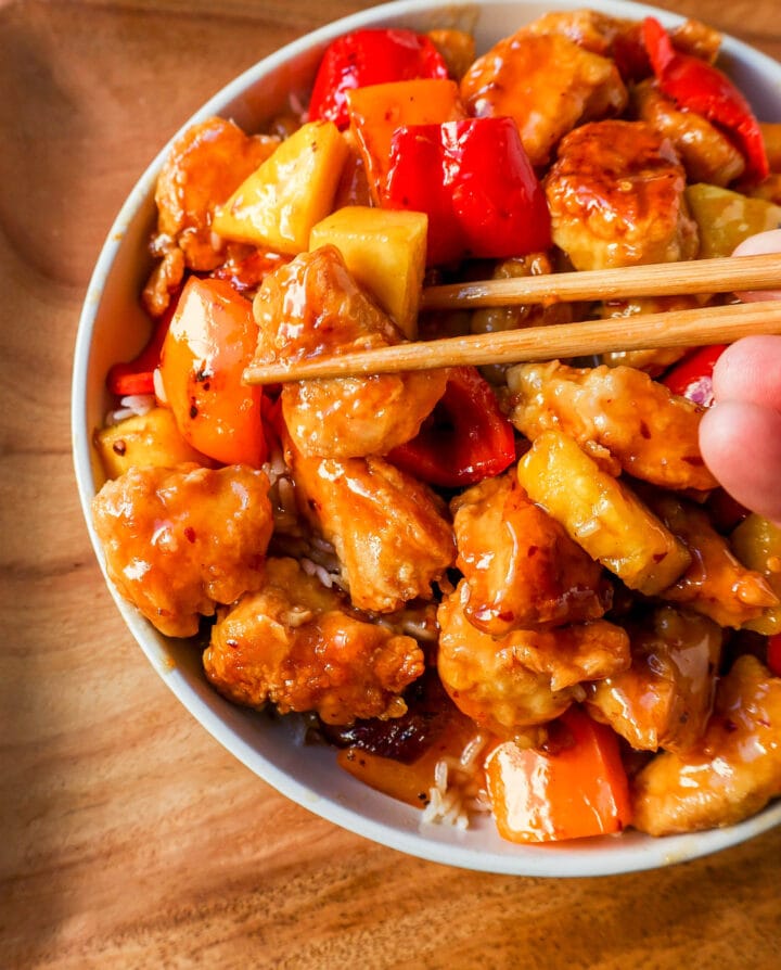 Sweet and Sour Chicken is made with crispy fried chicken covered in a pineapple sweet and sour sauce. The ultimate Sweet and Sour Chicken Recipe is way better than take-out.  