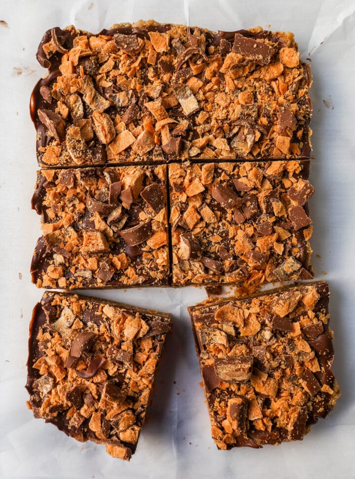 These Crunchy Butterfinger Bars are made with graham crackers, sweetened condensed milk, melted butter, Butterfinger candy bars, and topped with milk chocolate. These are the perfect creamy and crunchy peanut butter chocolate Butterfinger bars!