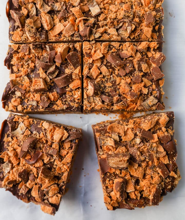 These Crunchy Butterfinger Bars are made with graham crackers, sweetened condensed milk, melted butter, Butterfinger candy bars, and topped with milk chocolate. These are the perfect creamy and crunchy peanut butter chocolate Butterfinger bars!