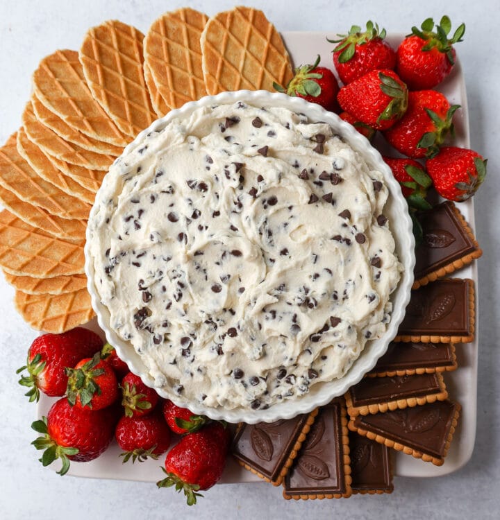 This is the Best Cannoli Dip Recipe made with ricotta cheese, mascarpone or cream cheese, powdered sugar, brown sugar, vanilla, and mini chocolate chips. 