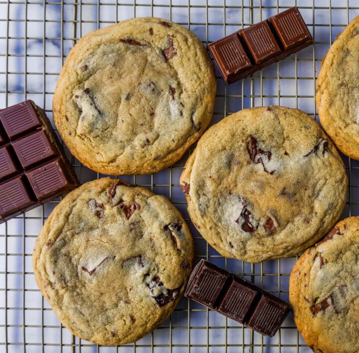 The famous Dominique Ansel Chocolate Chunk Cookie Recipe. How to make Dominique Ansel cookies at home. These chocolate chunk cookies are soft and chewy in the center with crisp edges and are full of melted chocolate.