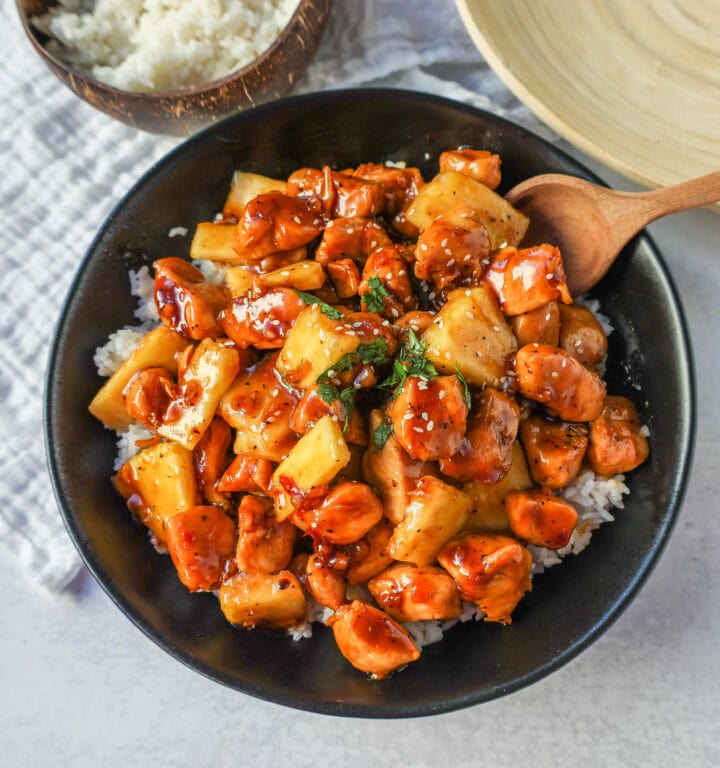 This Sticky Pineapple Chicken is made with chicken tossed in pineapple juice, sweet chili sauce, soy sauce, brown sugar, ginger, and fresh pineapple. This Hawaiian Chicken is perfectly sweet and sticky! 