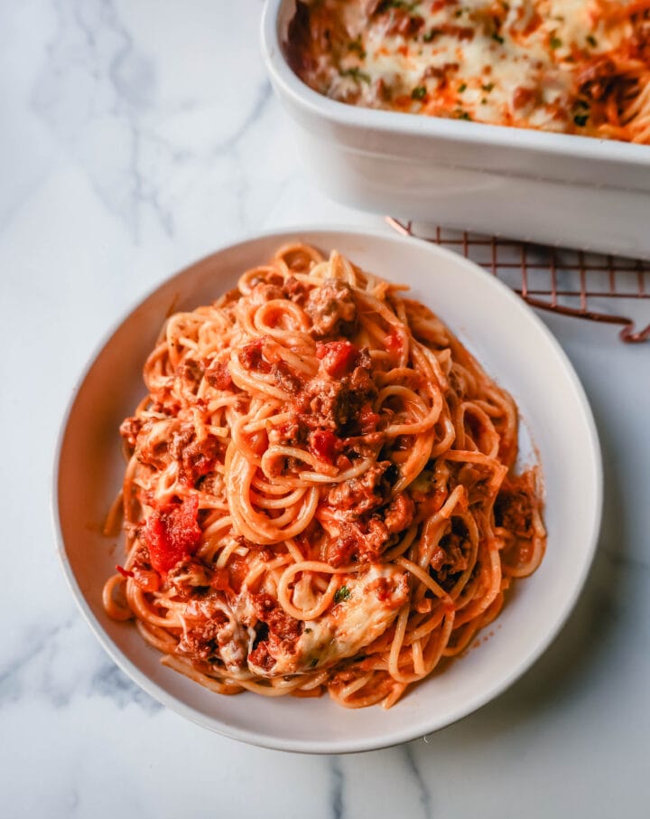 This Famous TikTok Million Dollar Spaghetti is made with a marinara meat sauce mixed with homemade alfredo sauce, tossed with spaghetti noodles, and baked with mozzarella cheese until bubbly. It is the best baked spaghetti recipe!