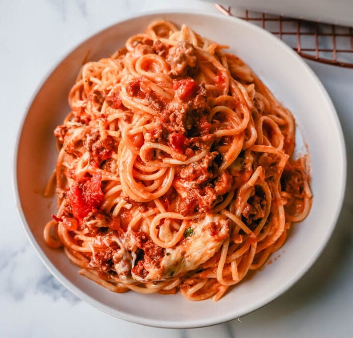 This Famous TikTok Million Dollar Spaghetti is made with a marinara meat sauce mixed with homemade alfredo sauce, tossed with spaghetti noodles, and baked with mozzarella cheese until bubbly. It is the best baked spaghetti recipe!