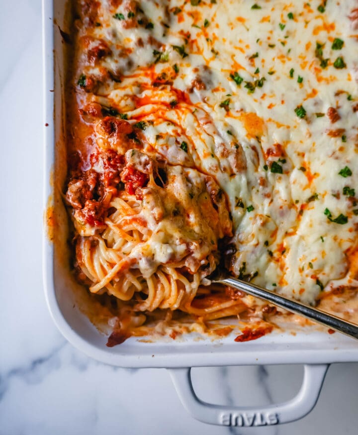 This Famous TikTok Million Dollar Spaghetti is made with a marinara meat sauce mixed with homemade alfredo sauce, tossed with spaghetti noodles, and baked with mozzarella cheese until bubbly. It is the best baked spaghetti recipe!