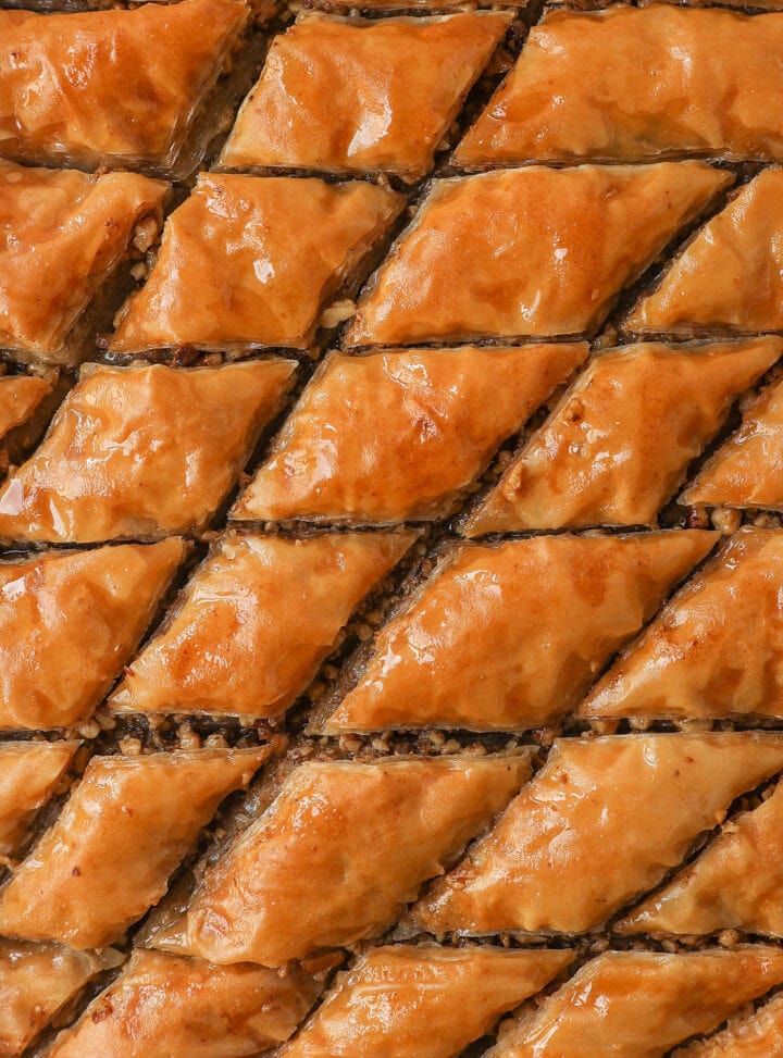 This is the best Baklava recipe made with layers of crisp, flaky, and buttery phyllo dough with crunchy cinnamon walnuts and soaked in sweet honey syrup. This is the most popular Greek dessert for good reason. Here are step-by-step instructions for making homemade Greek Baklava.