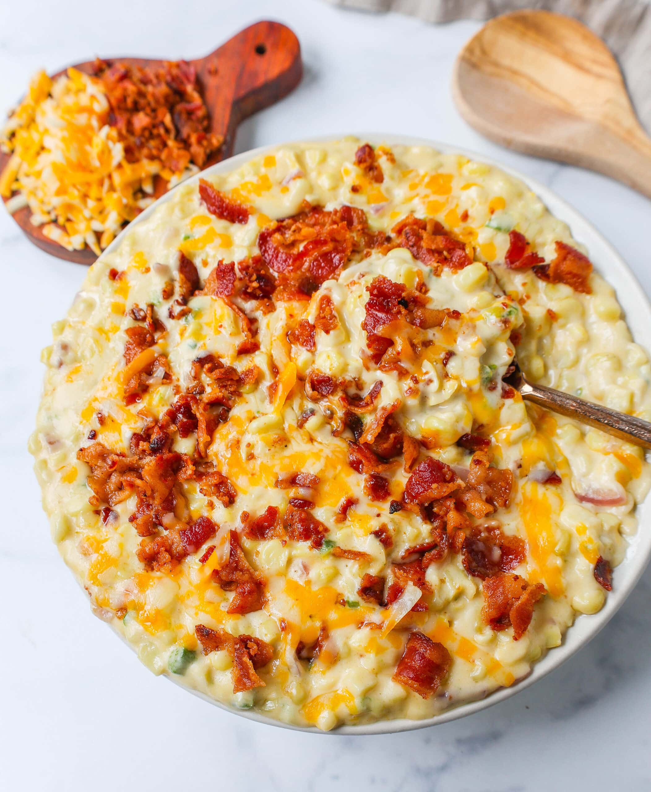 This homemade creamed corn with crispy bacon is the perfect easy side dish recipe. This is always the biggest hit at any dinner and the first vegetable side dish to be finished. 