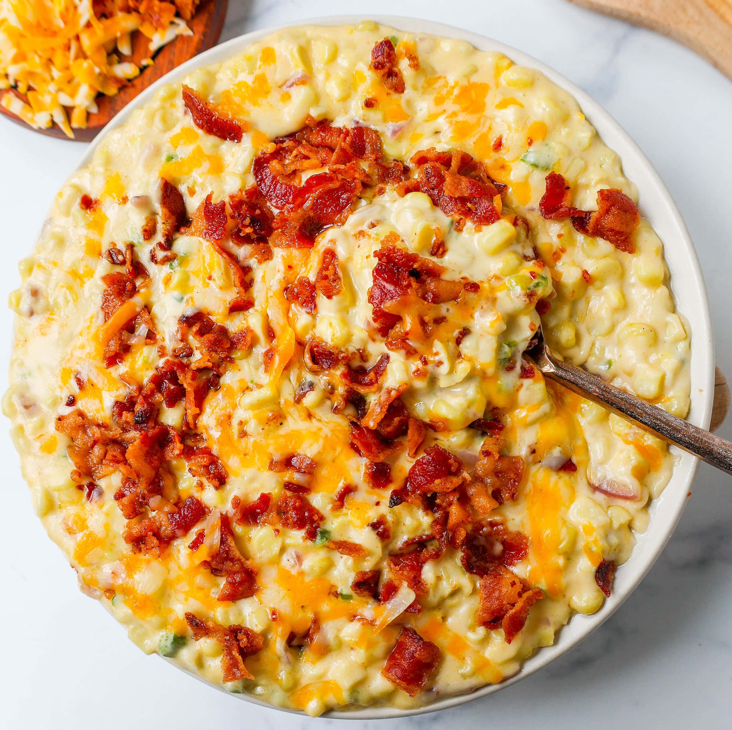 This homemade creamed corn with crispy bacon is the perfect easy side dish recipe. This is always the biggest hit at any dinner and the first vegetable side dish to be finished. 