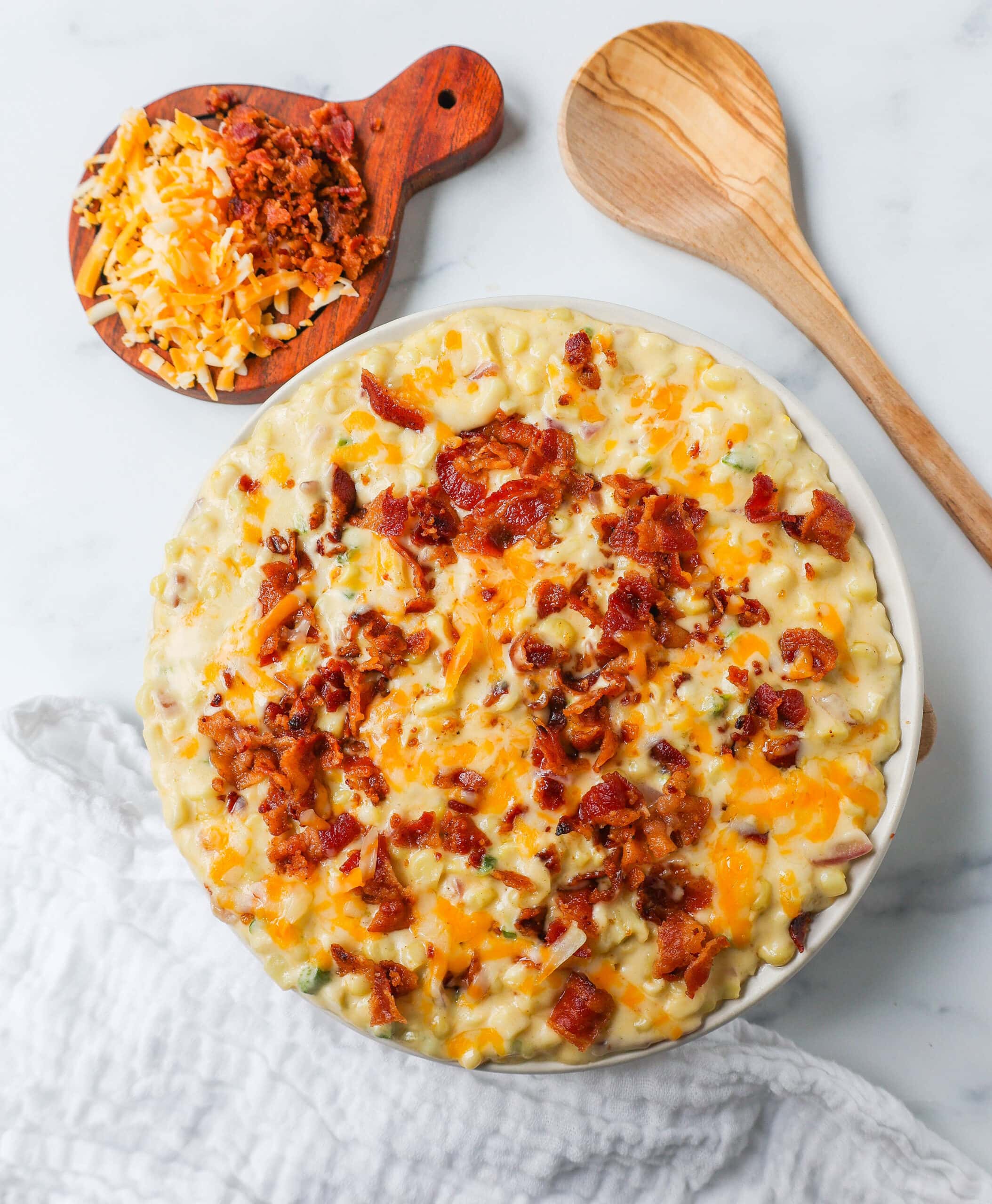 This homemade creamed corn with crispy bacon is the perfect easy side dish recipe. This is always the biggest hit at any dinner and the first vegetable side dish to be finished. 