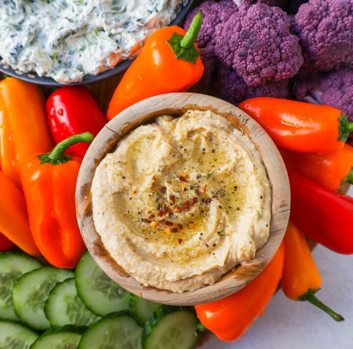 Veggie Platter with Dips. How to make a beautiful Crudite Platter with vegetables and dips. I am sharing my favorite veggie dip recipes, what vegetables to put on a veggie tray, and how to arrange one. It is so easy to make a stunning vegetable platter!