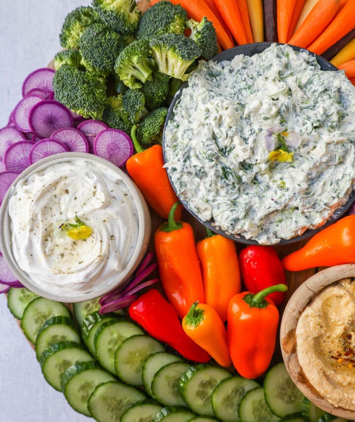Veggie Platter with Dips. How to make a beautiful Crudite Platter with vegetables and dips. I am sharing my favorite veggie dip recipes, what vegetables to put on a veggie tray, and how to arrange one. It is so easy to make a stunning vegetable platter!