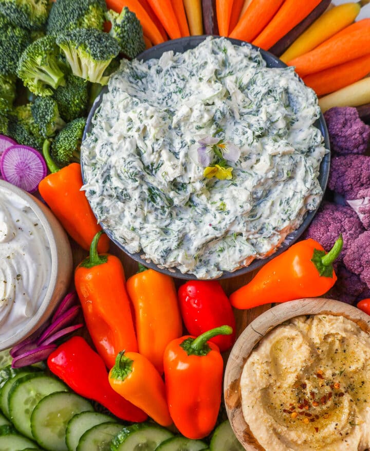 How to make a beautiful Crudite Platter with vegetables and dips. I am sharing my favorite veggie dip recipes, what vegetables to put on a veggie tray, and how to arrange one. It is so easy to make a stunning vegetable platter!