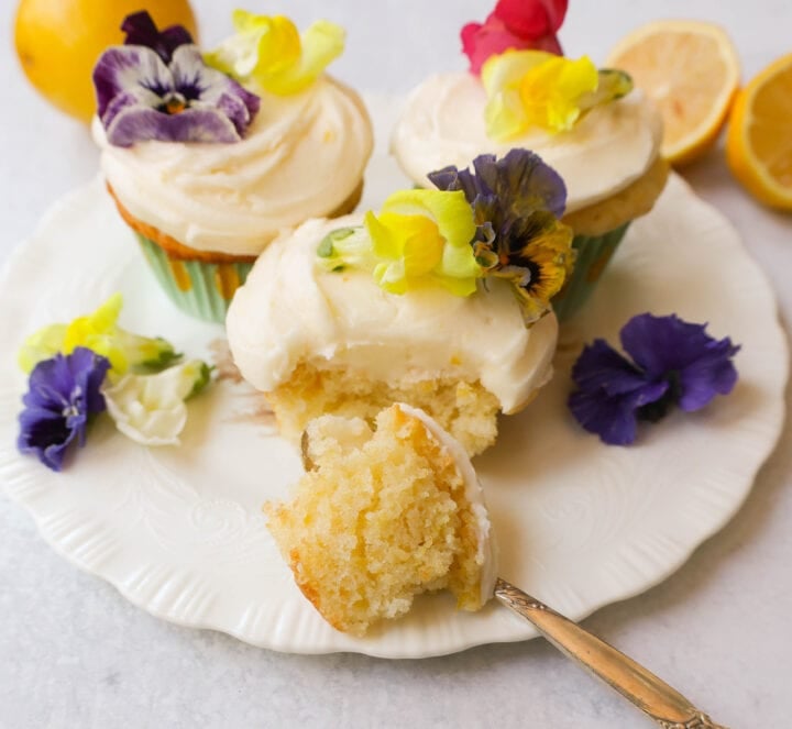 Light, fluffy homemade lemon cupcakes with fresh lemon frosting are the perfect dessert for lemon lovers. This is the best lemon cupcake recipe!