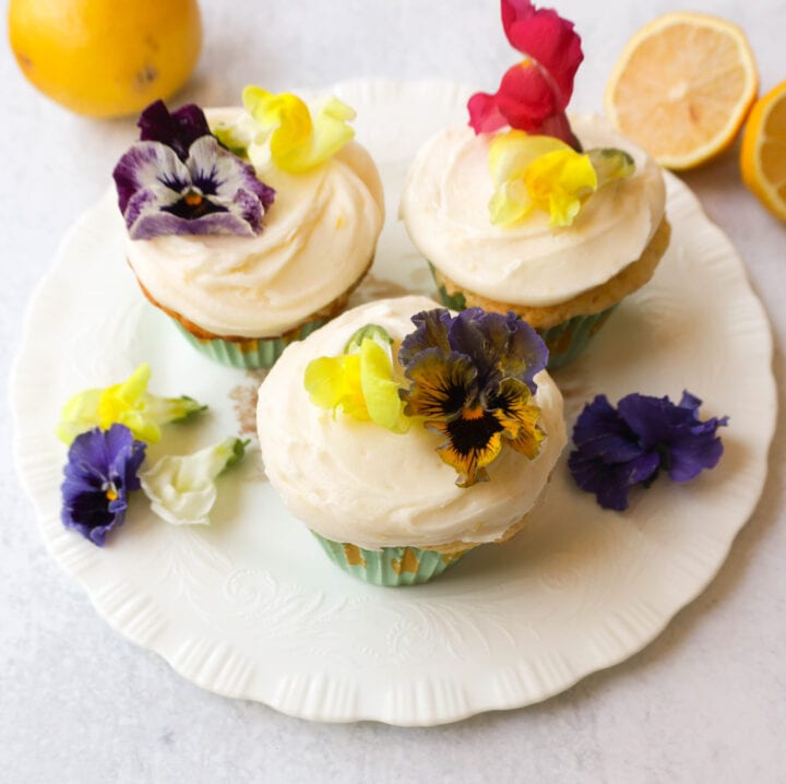 Light, fluffy homemade lemon cupcakes with fresh lemon frosting are the perfect dessert for lemon lovers. This is the best lemon cupcake recipe!
