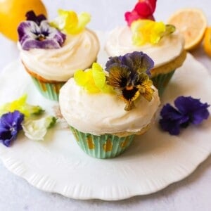 Light, fluffy homemade lemon cupcakes with fresh lemon frosting are the perfect dessert for lemon lovers. This is the best lemon cupcake recipe!