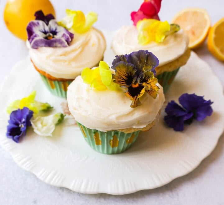 Light, fluffy homemade lemon cupcakes with fresh lemon frosting are the perfect dessert for lemon lovers. This is the best lemon cupcake recipe!