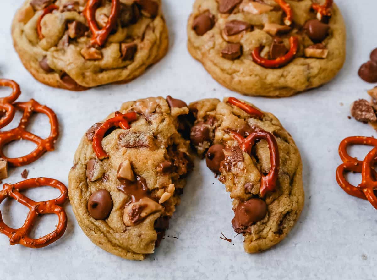 A thick and chewy chocolate toffee pretzel cookie split in half. They’re the perfect mix of salty and sweet with a tasty crunch from the pretzels and toffee! 